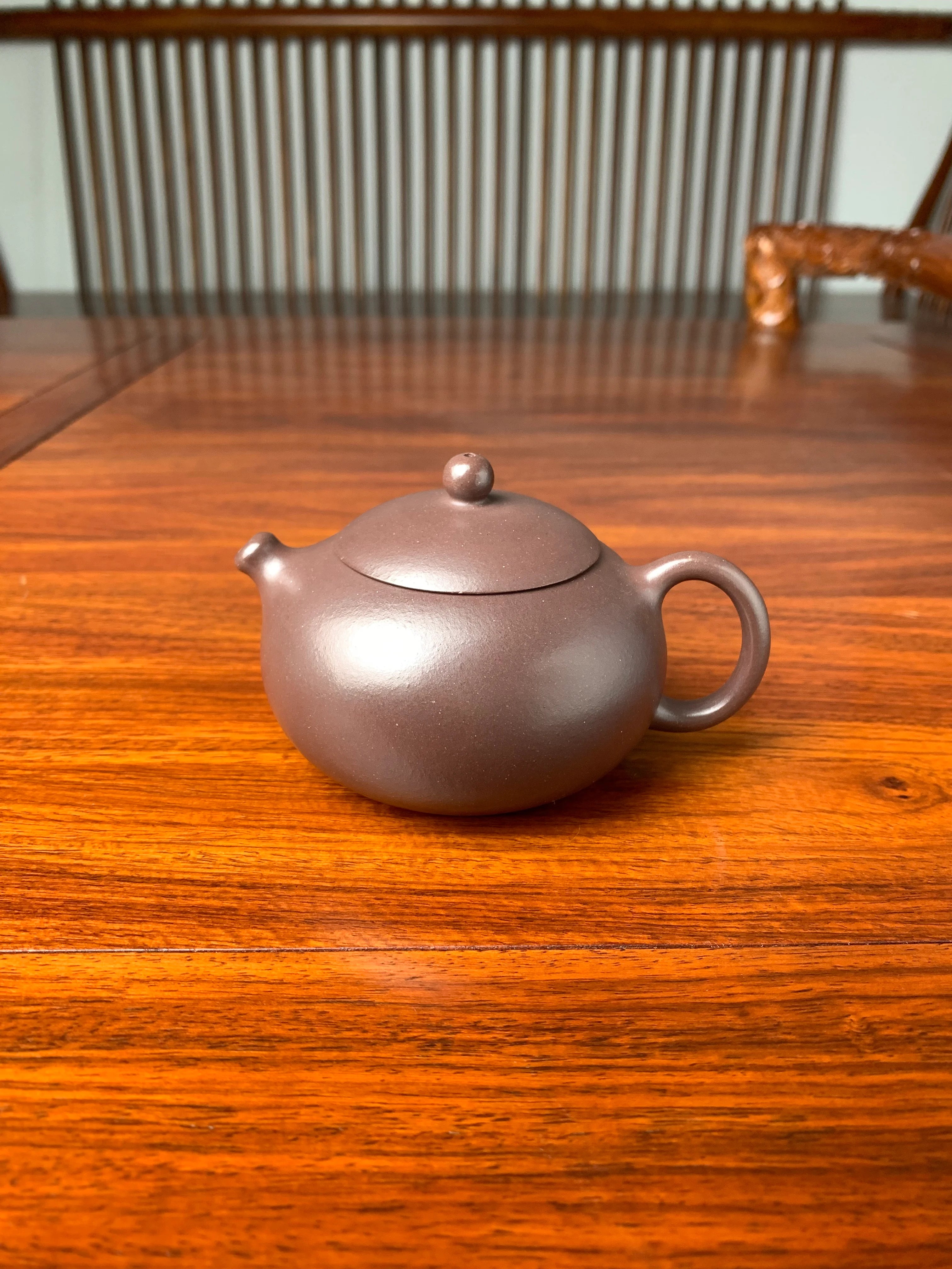 handmade yixing teapot named xi shi on the table